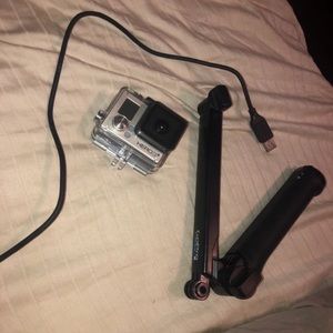 Go Pro with arm extension and charger